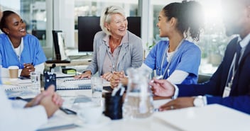 Two members of the HR department speak with nurses about how AI for healthcare administration prevents staffing shortages.