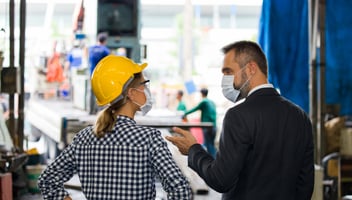 Employees discussing root causes of possible workplace incidents