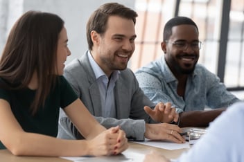 Human resource planning: happy team at a meeting