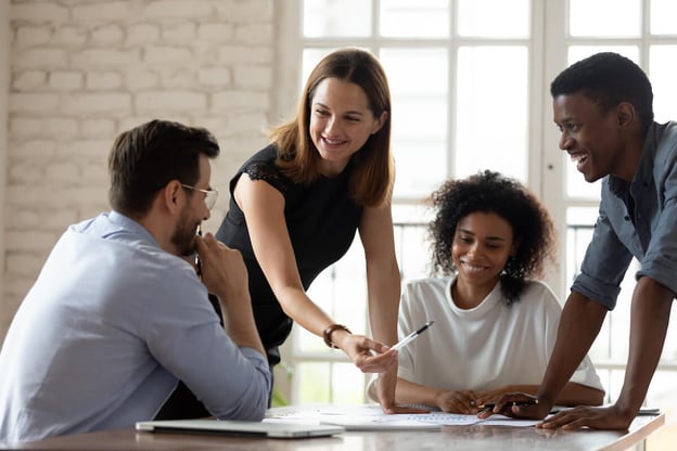 4 employees discussing something