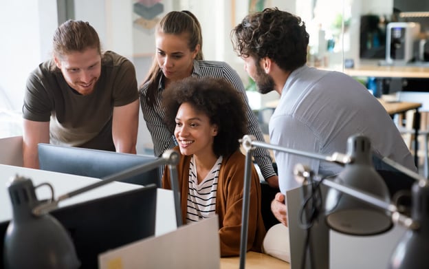 Employees looking at a computer