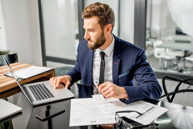 Manager using a laptop