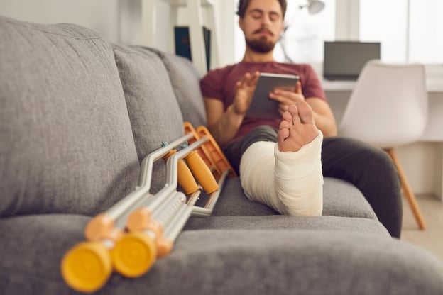Injured man using a tablet