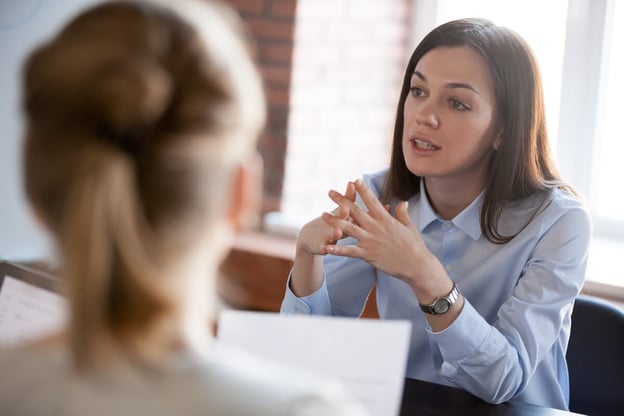 Entrepreneur talking to her employees