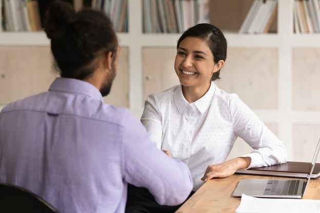 Employee shaking hands with an HR manager