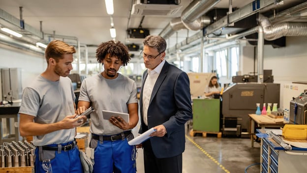 Engineer and workers going over some safety concerns of an item
