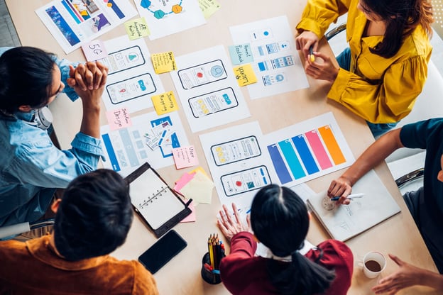 Web, app and UX designers brainstorming