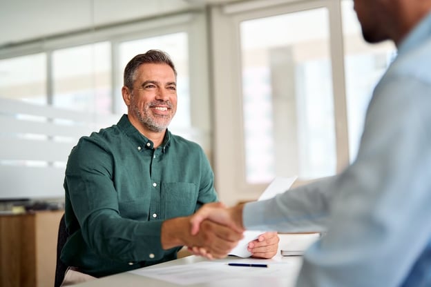 Employee shaking hands with his manager