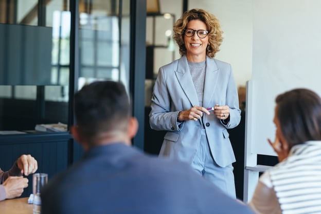 Entrepreneur presenting to her team