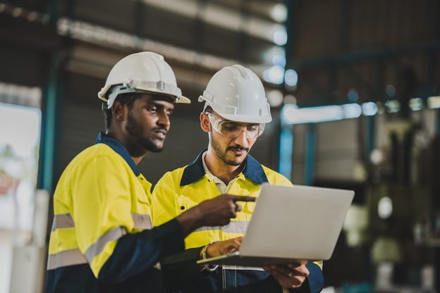 Business process analysis: engineers using a laptop