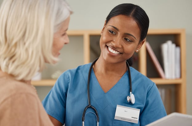 FMLA Arizona: nurse talking to her patient