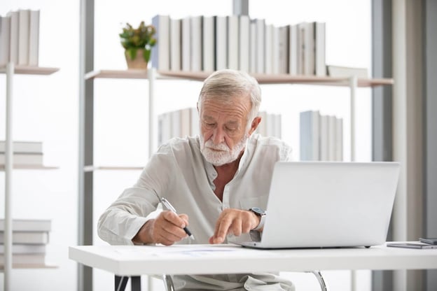 Business owner reviewing his company's FMLA confidentiality rules