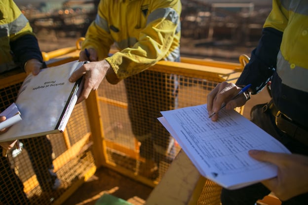 Workers checking on work permits