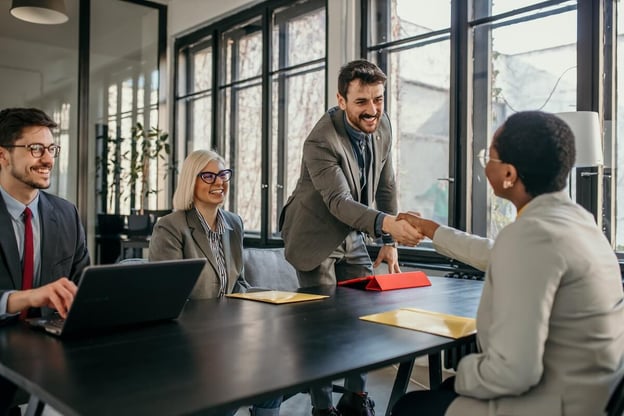 Entrepreneur shaking hands with a manager
