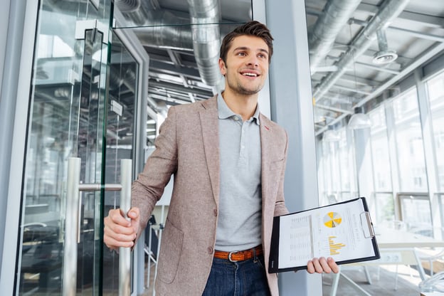Happy employee holding a clipboard