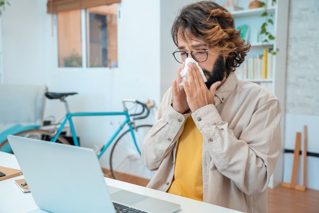 Leave of absence tracking: employee blowing his nose