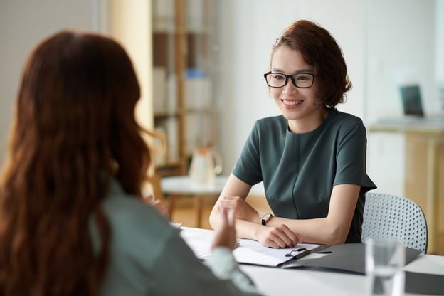 Entrepreneur talking to her client