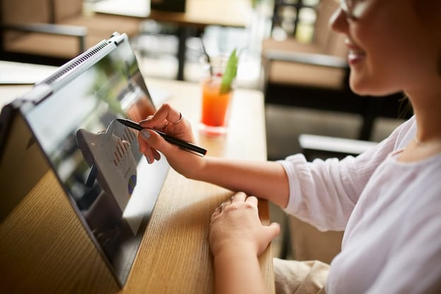 Digitizing business: entrepreneur using a convertible laptop