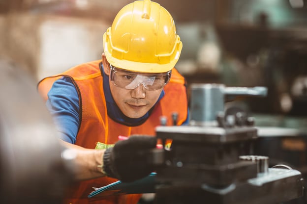 Safety topics for work: mechanical engineer checking a machine