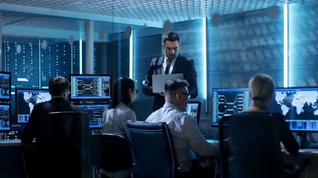 Supervisor checking in on his team while they're working