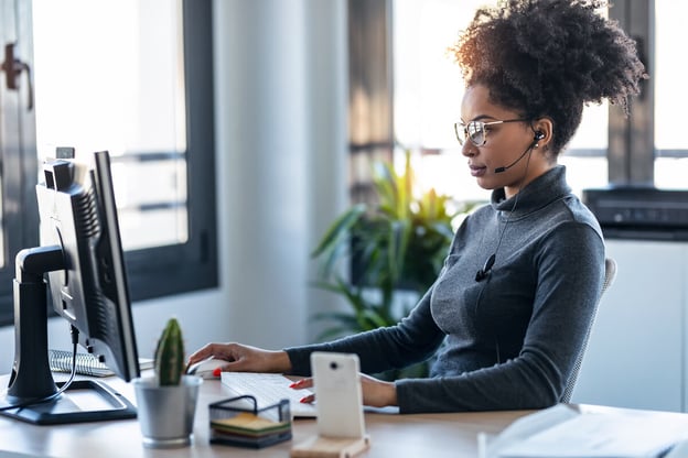 Woman wearing a headset while working
