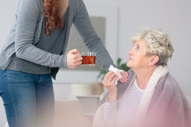 FMLA Massachusetts: woman taking care of her grandmother