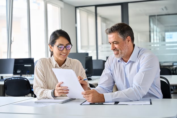 Business insurance claims: employee talking to a financial adviser