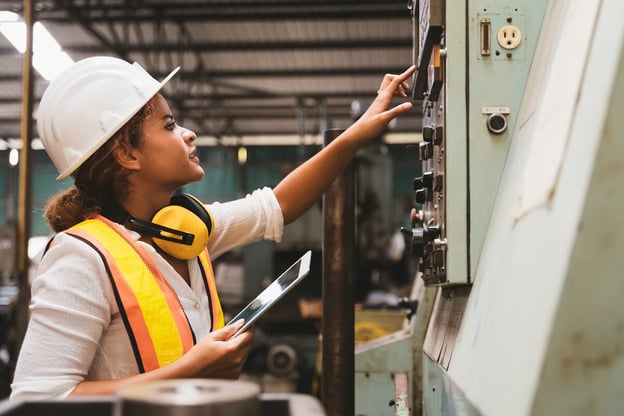 Claims automation: engineer checking a machine