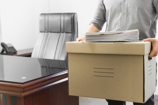 FMLA Texas: former employee carrying a box of his belongings