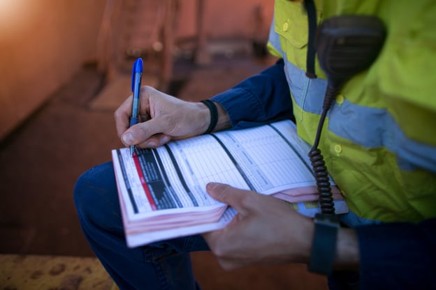 Personnel filling-out a form