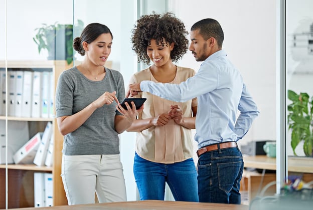 Colleagues using a tablet