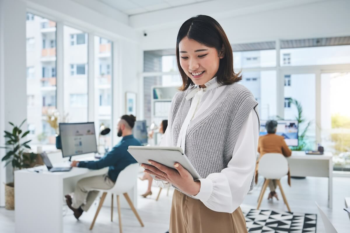 Manager happily using a tablet