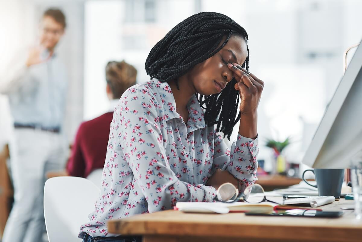 FMLA 3 day rule: stressed employee holding her nose bridge