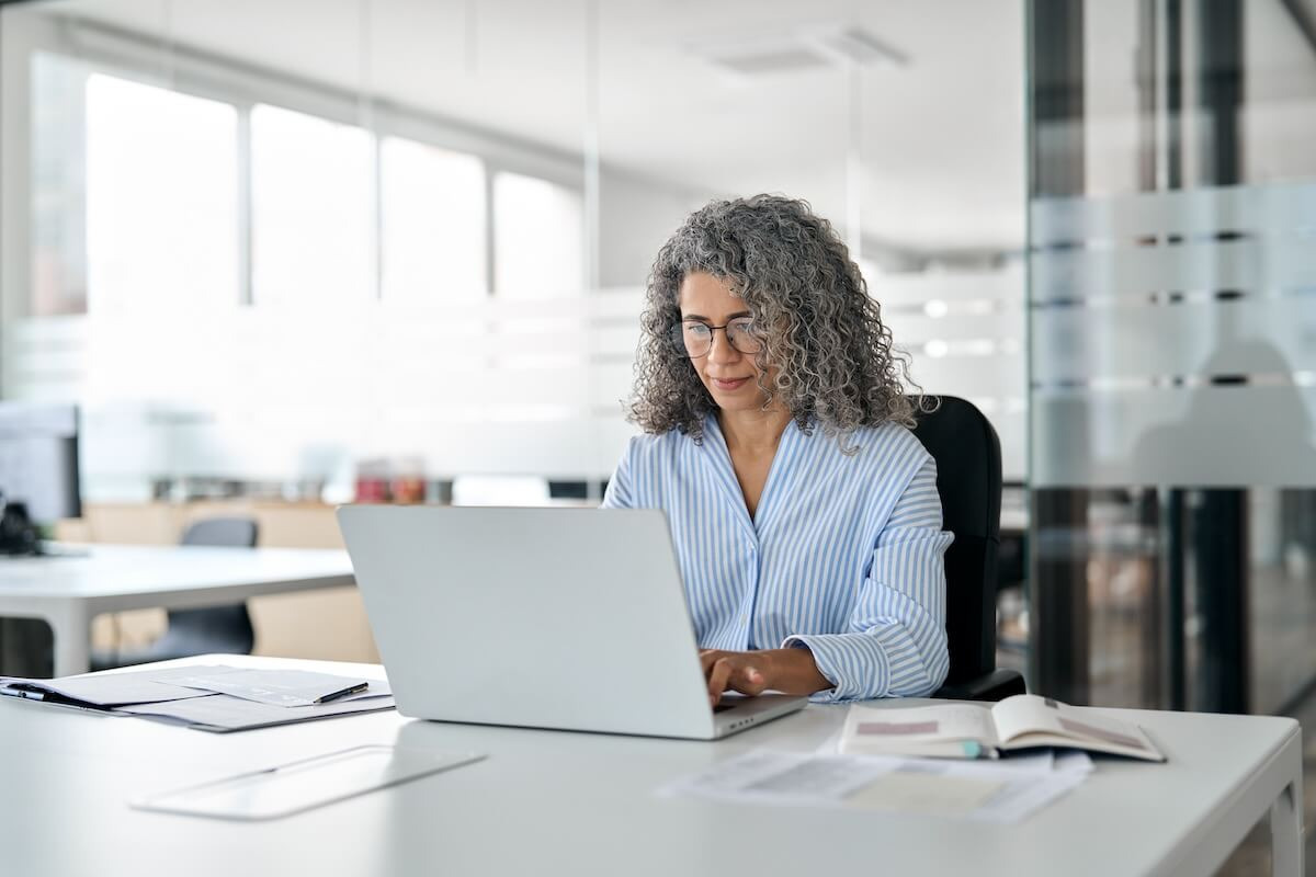 Senior entrepreneur using a laptop
