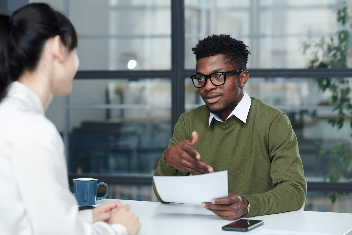 Improving employee leave management: entrepreneur talking to an employee