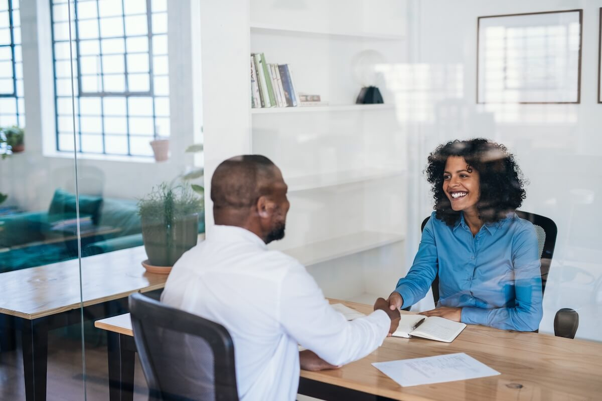 HR manager shaking hands with an employee