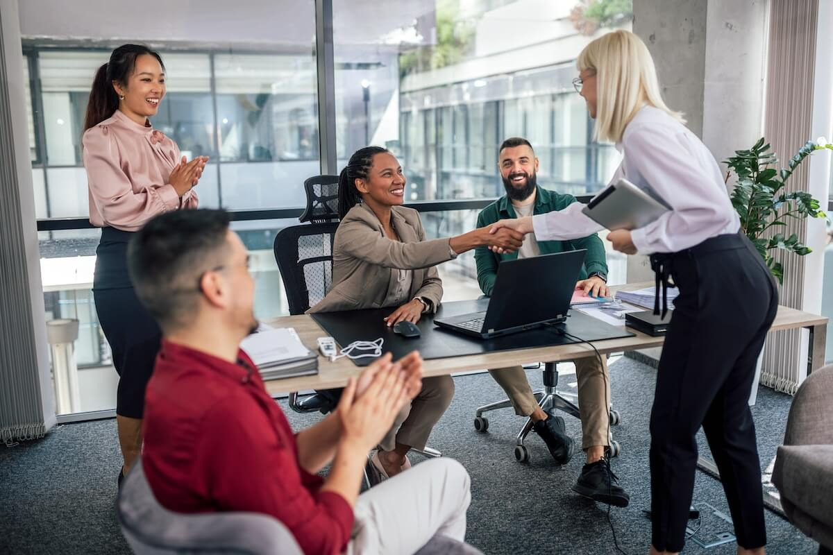HR team shaking hands with an applicant