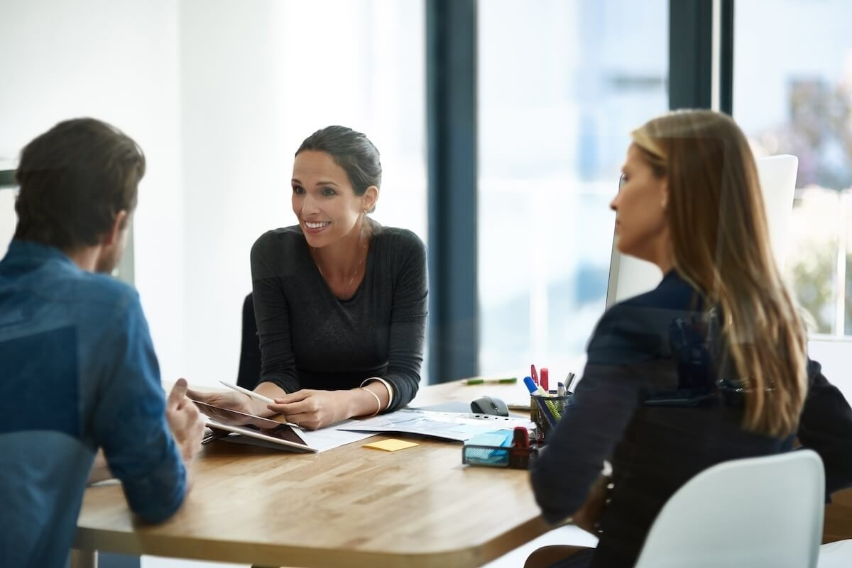 HR process automation best practices: HR employees are discussing work matters in their office