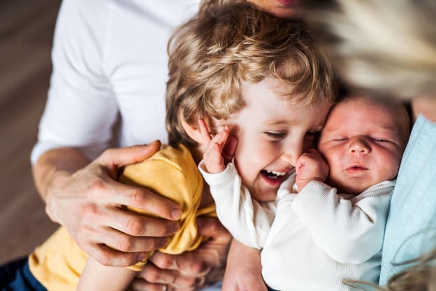 A toddler and a baby