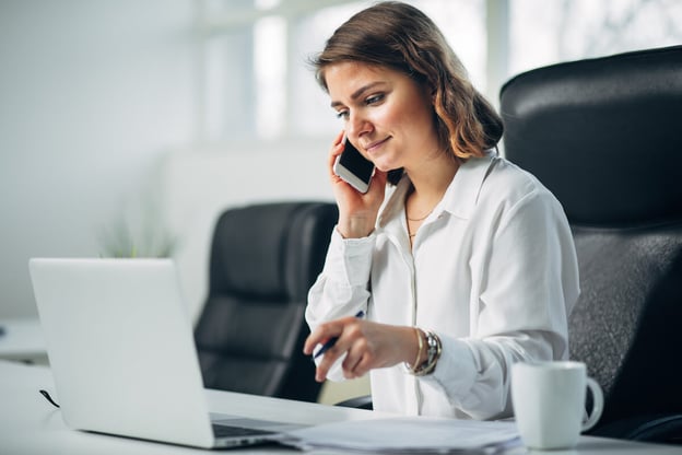 Automate HR: entrepreneur on the phone while working