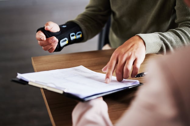 Short-term disability leave of absence: injured person reading a document