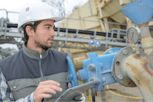 Man in hardhat doing a safety inspection/audit