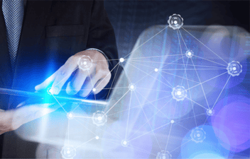 Person touching a tablet screen with a network representing a business user developing an application using no-code software