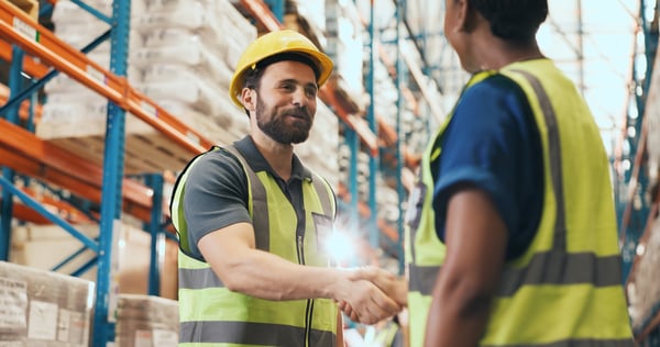 A supervisor welcomes a driver back after completing the return-to-duty process.