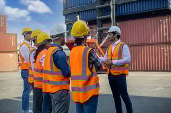 Safety topics for work: engineer talking to his team
