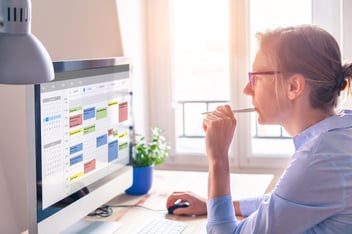 Intermittent FMLA: woman looking arranging her schedule using a digital calendar