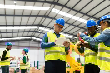 Engineers talking to each other about compliance in risk management