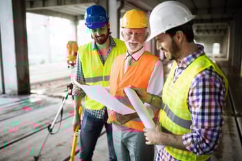 Engineers discussing their site's job safety analysis