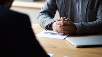 FMLA abuse: person with their hands clasped