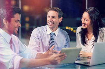 Digitization of customer experience: managers happily discussing something